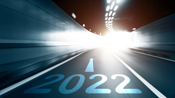 istock Empty traffic tunnel with number 2022 and arrow sign, blurred motion 1338993459
