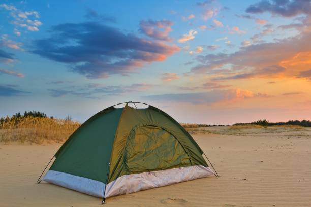 istock touristic tent on a sand at the evening 1338993583