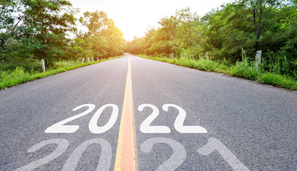 istock New year number 2021 turning to 2022 on empty asphalt road 1338993975