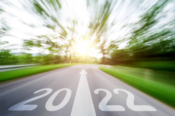 istock Empty asphalt road with Number 2022 and arrow sign, blurred motion 1338994243