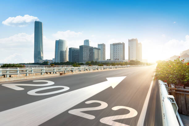 istock Number 2022 on empty road with modern cityscape on the background 1338994355