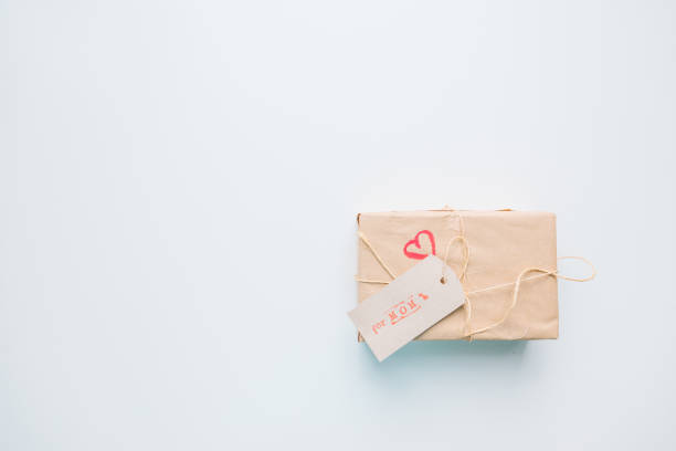 istock present gift box wrapped with craft paper and ribbon 1338995659