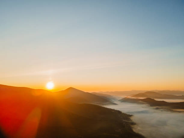 istock aerial view of sunrise above mountain range 1338995735