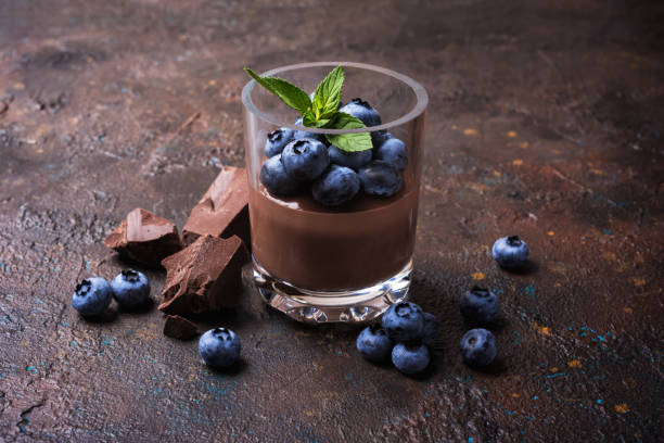 istock Chocolate pudding or sweet mousse with blueberry and mint 1338998337