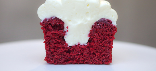 Red velvet cupcake filled with cream cutted cross section