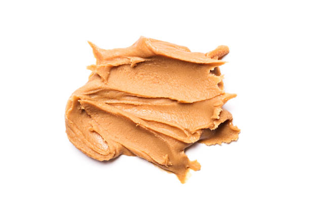Sweet peanut paste or butter Sweet peanut paste or butter isolated on white background peanut butter stock pictures, royalty-free photos & images