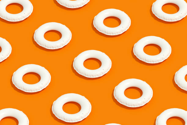 istock Inflatable Ring, Minimal Summer Holiday Travel Background, Isometric View, Orange Background 1339001925