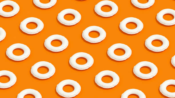 istock Inflatable Ring, Minimal Summer Holiday Travel Background, Isometric View, Orange Background 1339001943