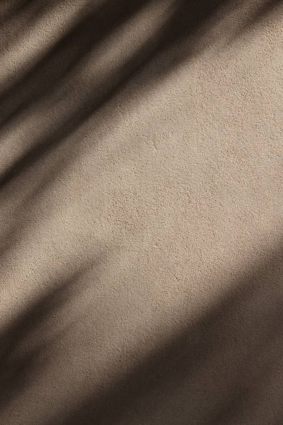 istock Part of a concrete wall with shadows 1339002086