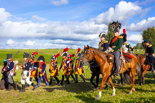 Borodino, Moscow Region, Russia - September 05, 2021: The Borodino battle in the war between Russia and France in 1812 was re-enacted by participants, who wore French and Russian replica uniforms and took the roles of soldiers, officers, and generals.