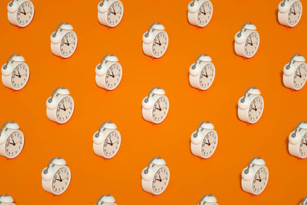 istock Alarm Clock on Orange Color Background 1339006001