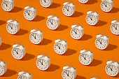 istock Alarm Clock on Orange Color Background 1339006822
