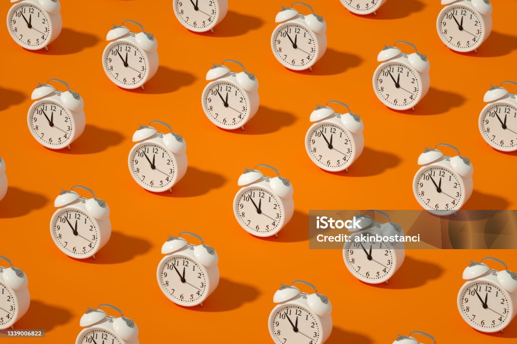 Alarm Clock on Orange Color Background 3d rendering of Alarm Clock on Orange Color Background. Countdown, reminder, deadline concept. Clock Stock Photo