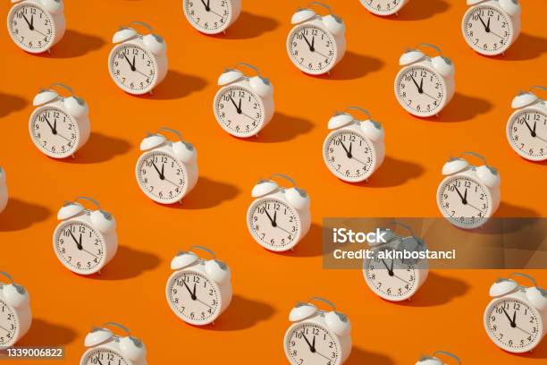 Alarm Clock On Orange Color Background Stock Photo - Download Image Now - Clock, Time, Alarm Clock