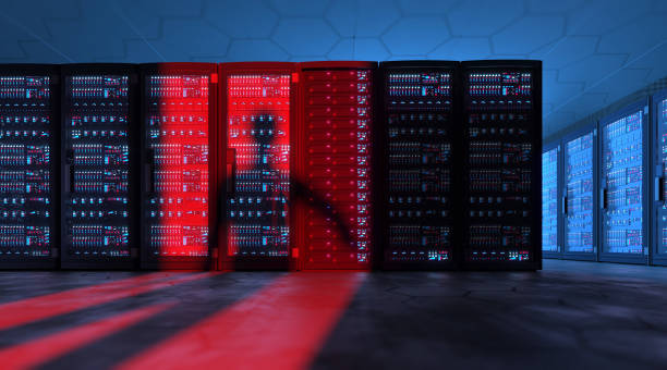 istock Shadow of a suspicious hacker entering a server room 1339007130