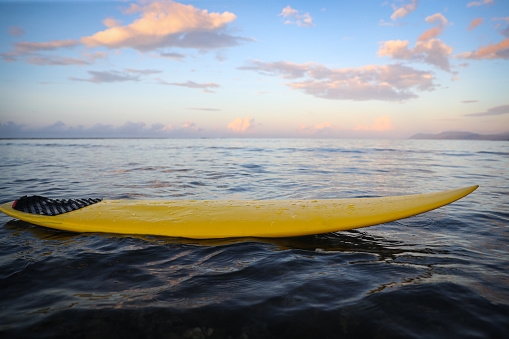 Stand Up Paddle Fins with boats in the background