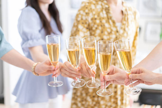 istock Young man and woman toasting at a party 1339011675