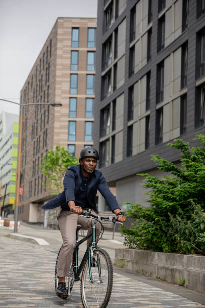 istock Commuting Businessman Cycling His Bicycle 1339012886