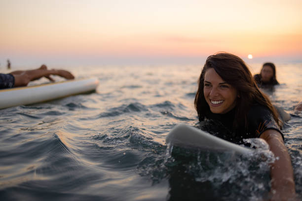 istock Two happy Caucasian women surfing while on a vacation 1339013918