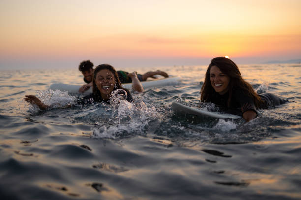 istock Two happy Caucasian women surfing while on a vacation 1339013922