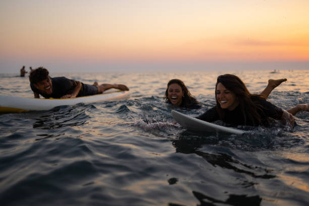 istock Two happy Caucasian women surfing while on a vacation 1339013923