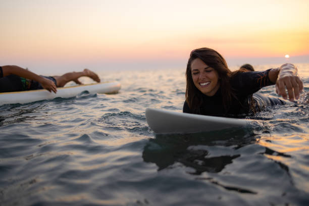 istock Two happy Caucasian women surfing while on a vacation 1339013938