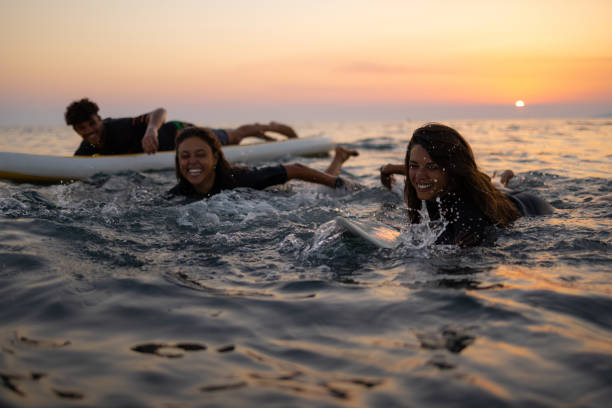 istock Two happy Caucasian women surfing while on a vacation 1339014199