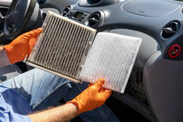 istock Replacing the dirty cabin pollen air filter for a car 1339014462