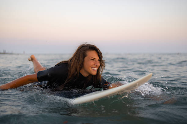 istock Happy Caucasian women surfing while on a vacation 1339014560
