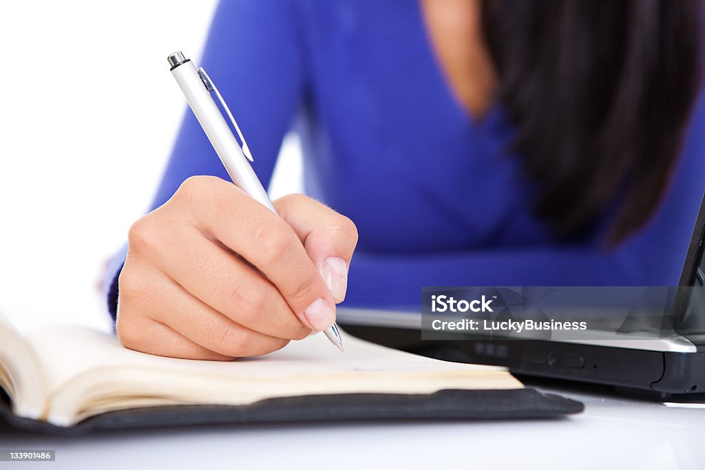 handwriting females hand making note,  (hand with pen in focus) Fingernail Stock Photo