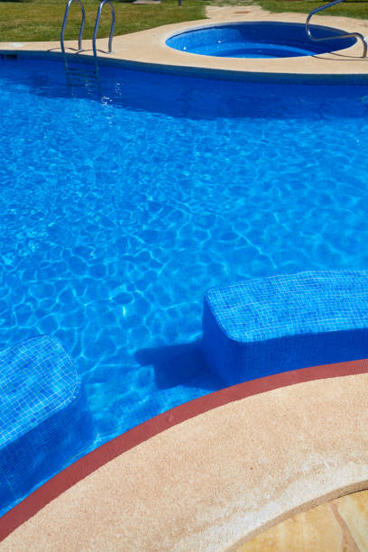 istock Blue tiles swimming pool water texture 1339016218