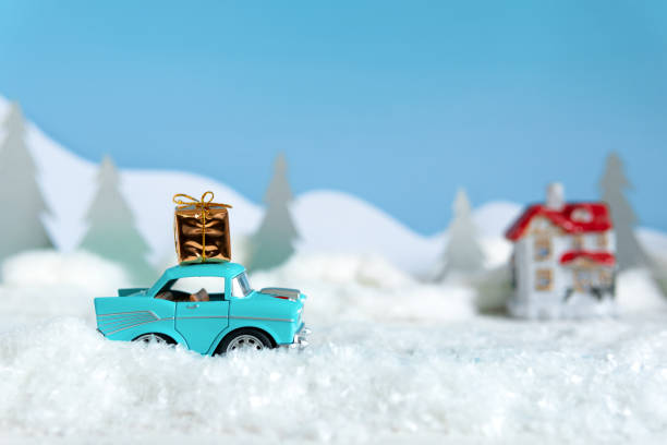 istock Snowy winter nature with a car carrying a Christmas tree. 1339017088