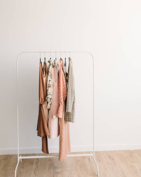 istock Rack with capsule clothes in beige and pink colors 1339018486