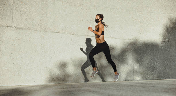 istock Woman on a morning run with face mask 1339018648