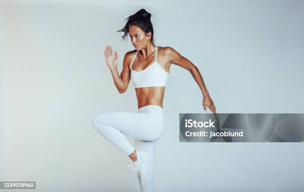 Monochrome Portrait Of A Fit Woman Exercising Stock Photo - Download Image Now - Exercising, Women, Healthy Lifestyle