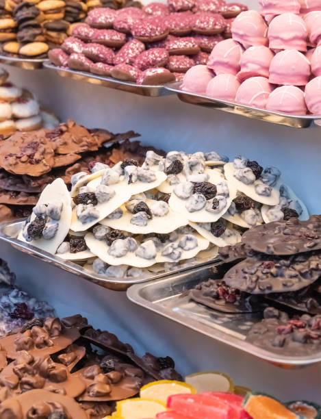 istock white and black chocolate with fruits and nuts, candies in a pink assorted sweets 1339021461