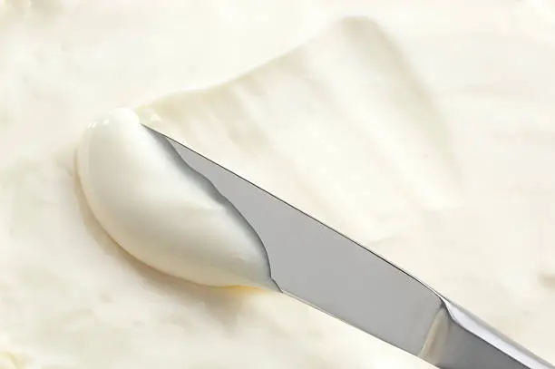 cream cheese with table knife