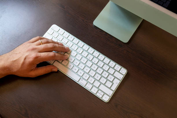 istock Hands typing on computer keyboard. man hands on the keyboard Working at home 1339021966