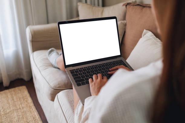 istock a woman working and typing on laptop computer with blank screen on sofa at home 1339022263