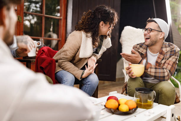 istock Cheerful friends enjoying in conversation on a patio. 1339025875