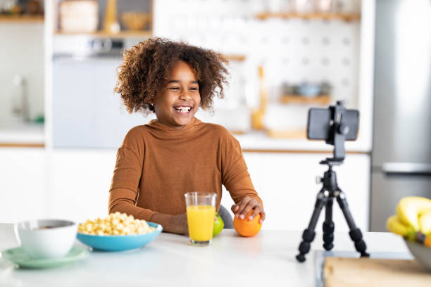 istock Happy black girl talking during vlogging at home. 1339027734