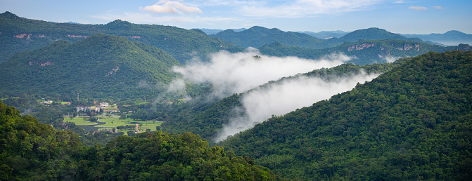 Panorama mountain view point on rainy season with white mist on the morning.