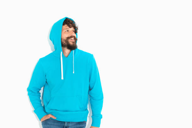 istock happy casual guy looking to side with a big smile 1339034383