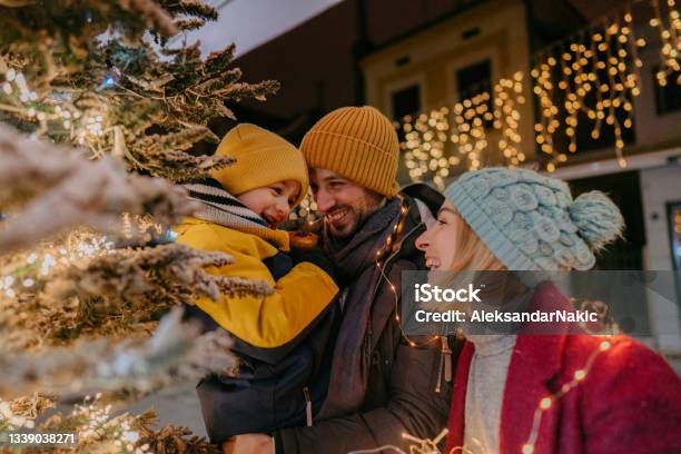Celebrating Christmas Outdoors With Our Son Stock Photo - Download Image Now - Christmas, Family, Winter