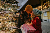 Romantic couple with Christmas presents outdoors