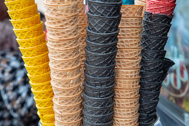 istock high stack of waffle cups, black, yellow cones for ice cream and yoghurt 1339039734
