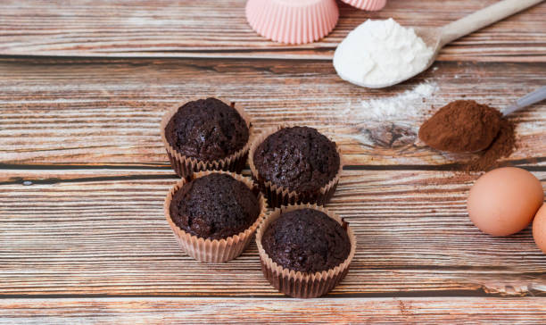 istock Chocolate muffins with coconut flakes. 1339040423