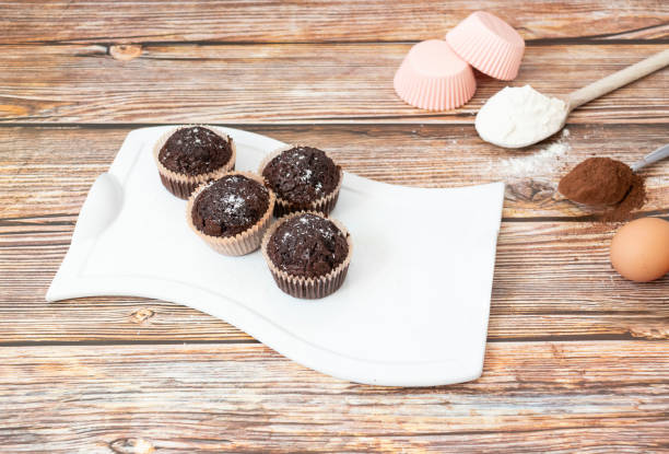 istock Chocolate muffins with coconut flakes. 1339040432