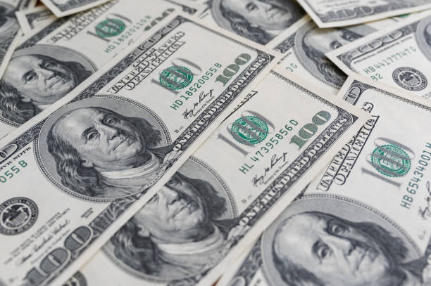 istock One Hundred Dollar Banknotes background. Dollars Closeup Concept 1339040475