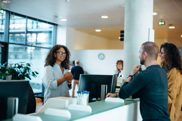 People receiving consultation at government office People receiving services and consultations in the hall of the municipal office. Government agency for paperwork. public utility stock pictures, royalty-free photos & images